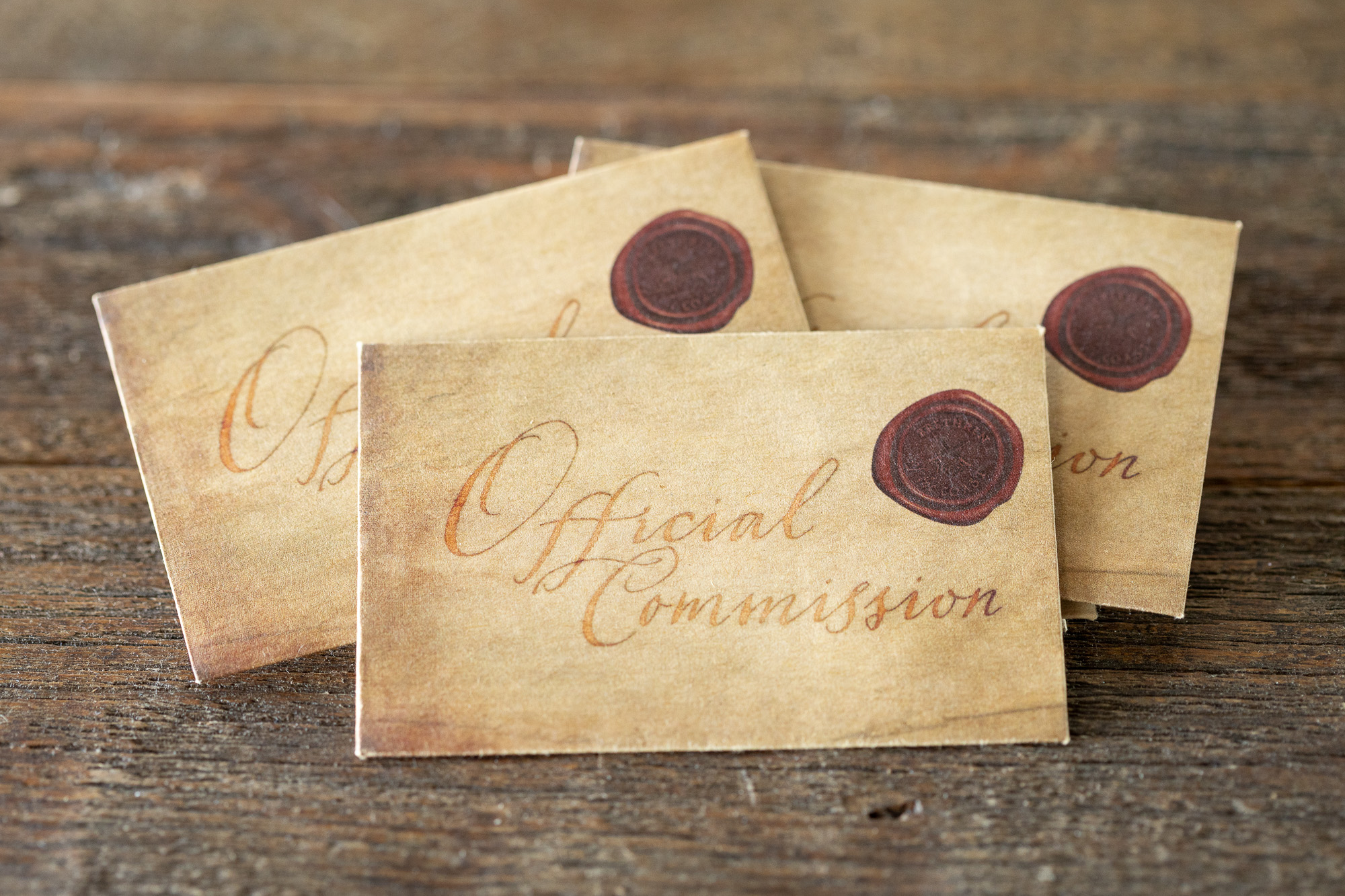 Three sealed Official Commission envelopes from Tortuga 1667 on a weathered table